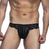 Man wearing a black lace thong